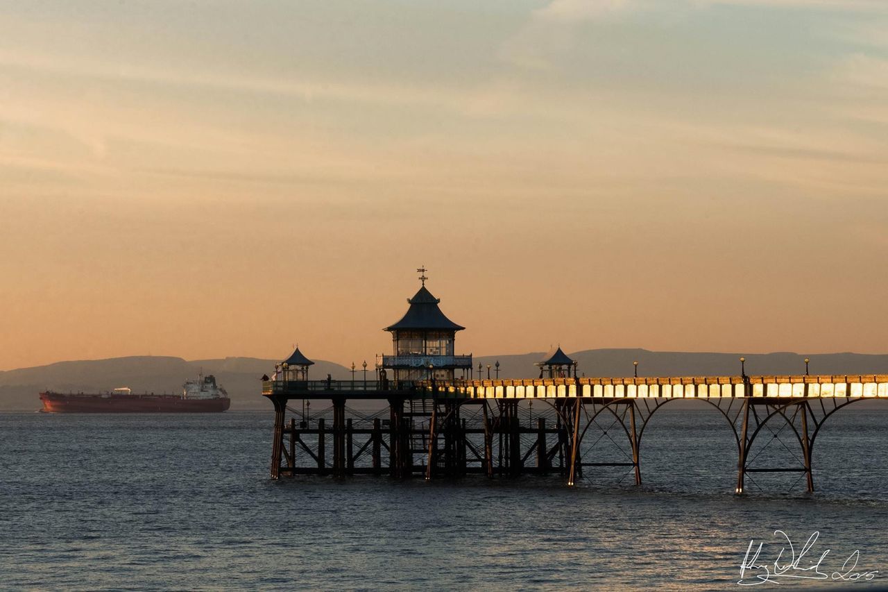 PIER ON SEA AT SUNSET