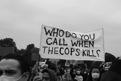 People on street against sky