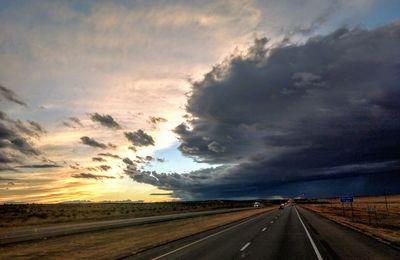 Highway against sky during sunset