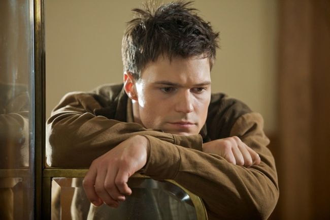 one person, indoors, young adult, portrait, headshot, young men, looking, contemplation, sitting, emotion, men, casual clothing, front view, brown hair, sadness, worried, close-up, adult, teenager, depression - sadness, waiting, teenage boys