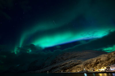 Scenic view of mountains against sky at night