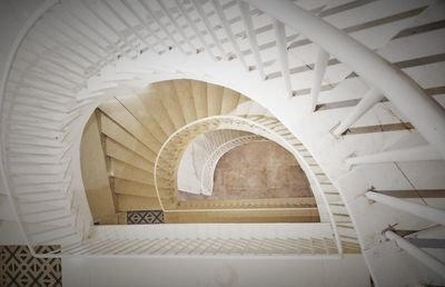 Directly below shot of spiral staircase in building