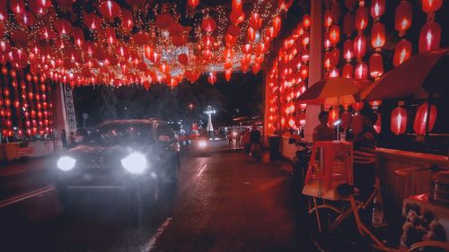 Illuminated lanterns hanging at night