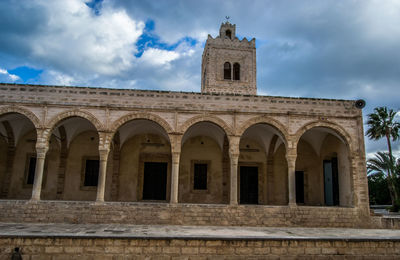 Low angle view of cathedral against cloudy sky