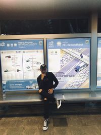 Man standing at railroad station