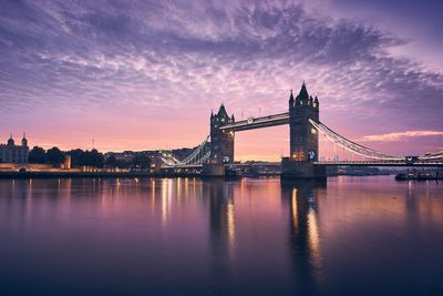 Skyline of london. tower bridge against cityscape at colorful sunrise.