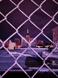 City seen through chainlink fence
