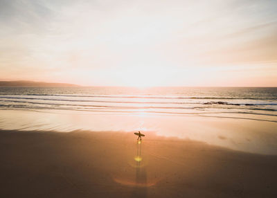 Scenic view of sea against sky at sunset