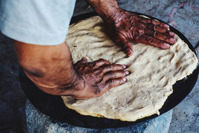 High angle view of man preparing food