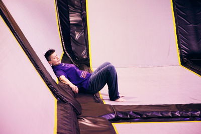 Woman relaxing on trampoline