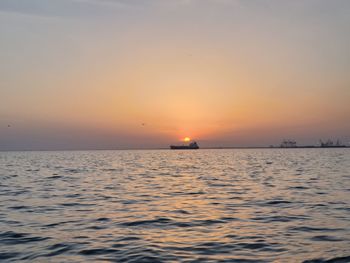 Scenic view of sea against sky during sunset