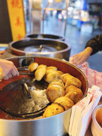 Cropped hand of person preparing food