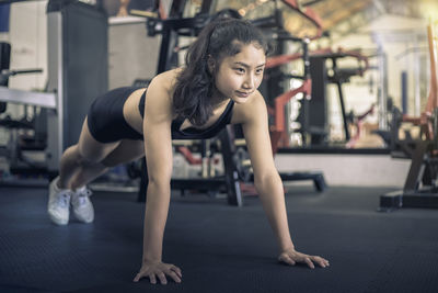 Woman exercising in gym