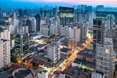 Aerial view of illuminated buildings in city