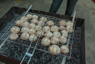 High angle view of meat on barbecue grill