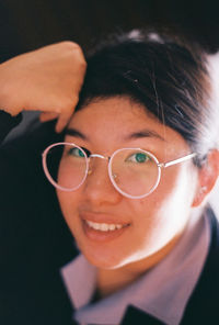Close-up portrait of a smiling young woman