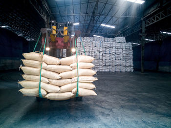 Sacks on machinery in factory warehouse