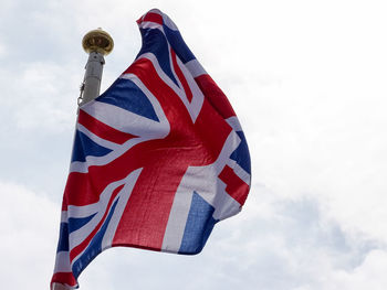 Low angle view of flag against sky