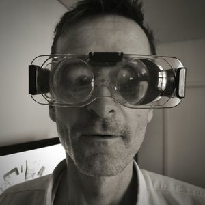 Portrait of mature man wearing eye test glasses in clinic