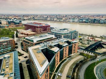 High angle view of river amidst buildings in city