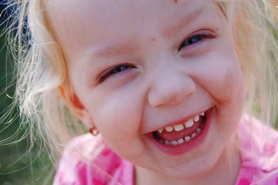 Close-up portrait of smiling girl