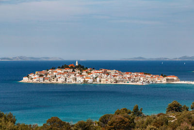 High angle view of town by sea