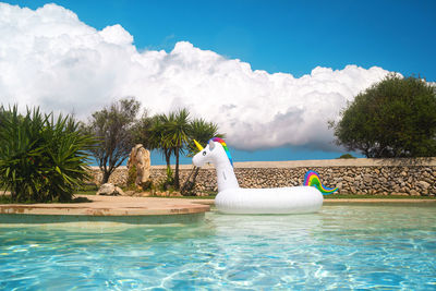 Swimming pool against blue sky