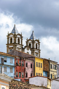 Historic baroque church towers rising between houses in the pelourinho, city of salvador, bahia