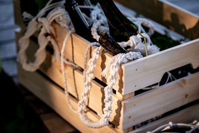 Close-up of rope tied up on wood