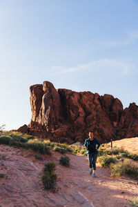 Senior asian woman hiking in the desert landscape