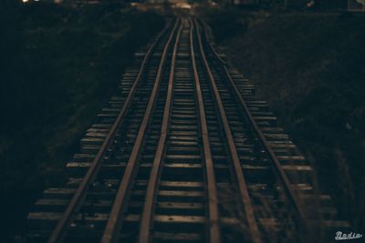 High angle view of railroad tracks at night