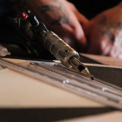 Close-up of man working on table