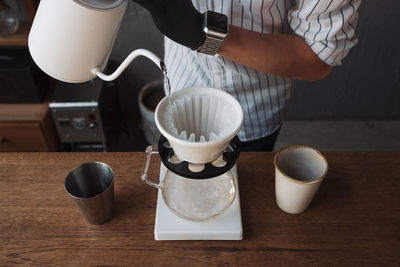 Barista dripping coffee and slow coffee bar style