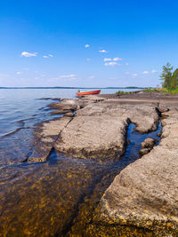 Scenic view of sea against blue sky