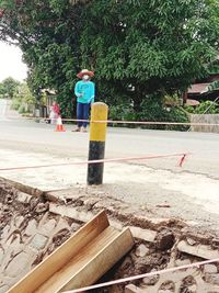 Man working on road in city