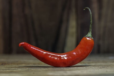 Close-up of red chili pepper on table