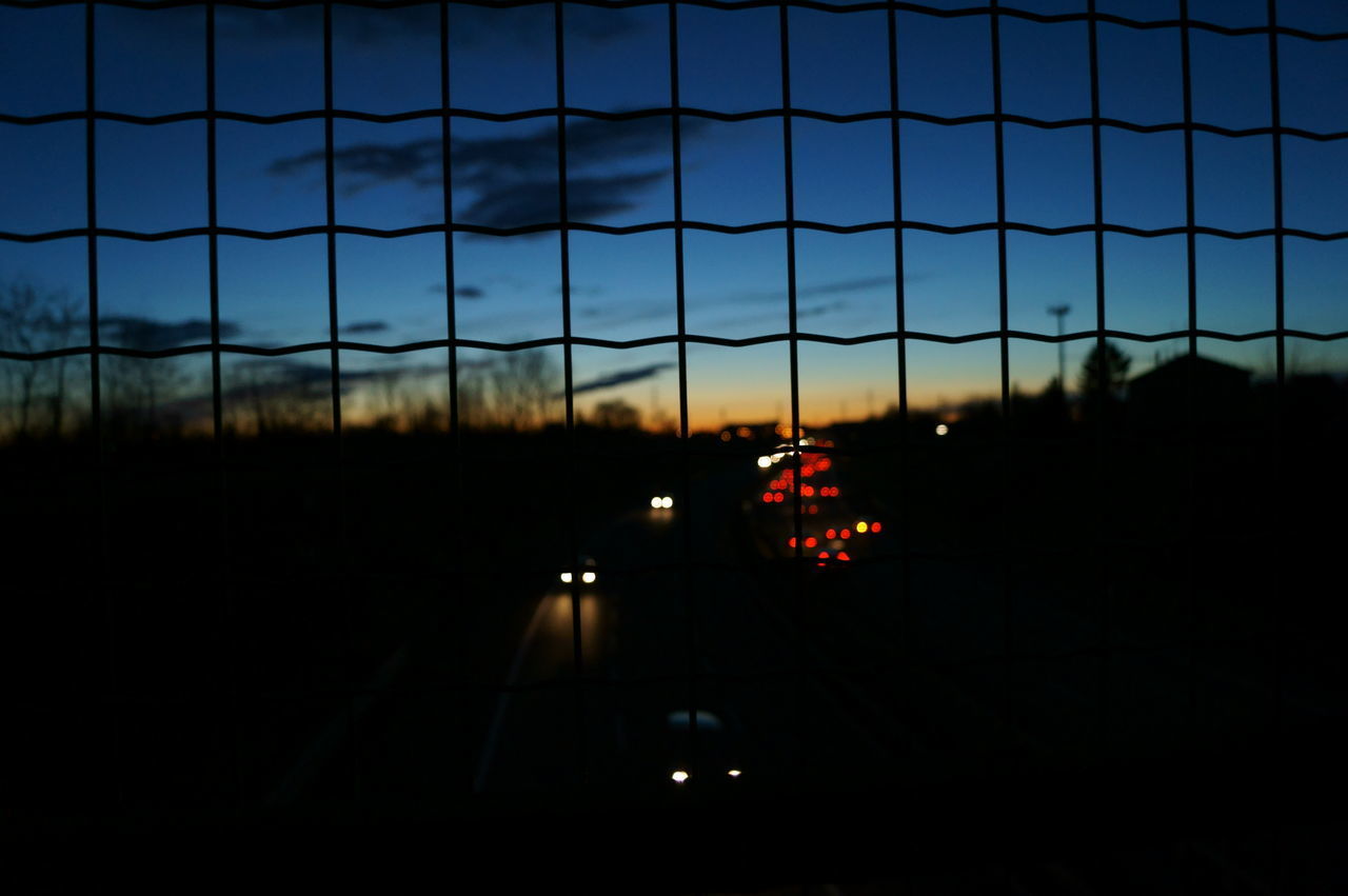 CAR ON ROAD AT NIGHT