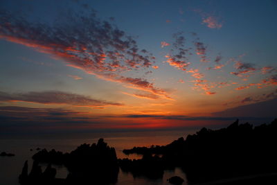 Scenic view of silhouette trees against sky during sunset