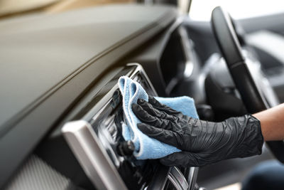 Close-up of hand holding car