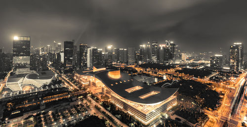 High angle view of illuminated cityscape against sky at night