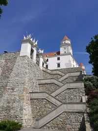 Low angle view of bell tower against sky