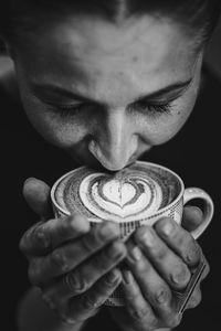 Close-up of woman drinking coffee 