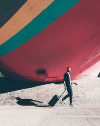 Full length of man standing on road