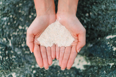 Close-up of hand holding hands