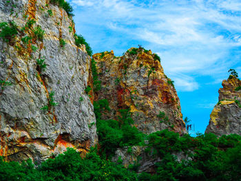 Low angle view of rock formations against sky