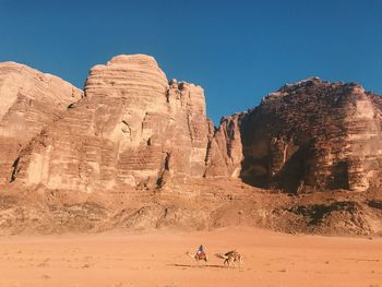 Rock formation on land against clear sky