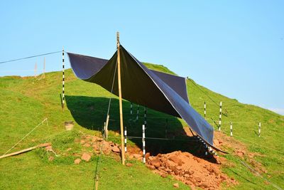 Scenic view of land against clear blue sky