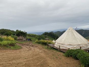 Scenic view of agricultural field against sky