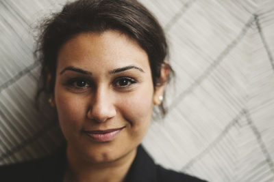 Close-up portrait of a smiling young woman