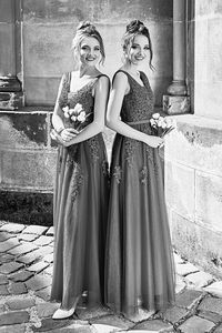 Rear view of woman standing against wall